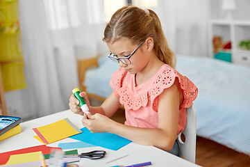 Image showing creative girl making greeting card at home