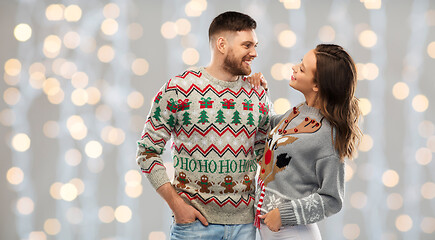 Image showing happy couple at christmas ugly sweater party