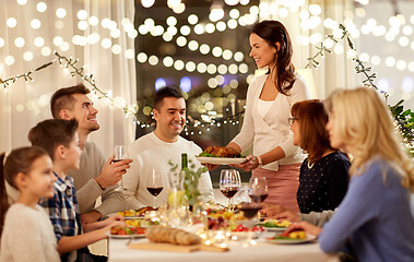 Image showing happy family having dinner party at home