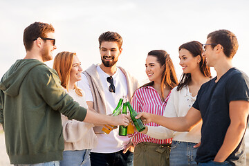 Image showing friends toasting non alcoholic drinks on beach