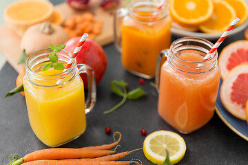 Image showing mason jar glasses of vegetable juices on table