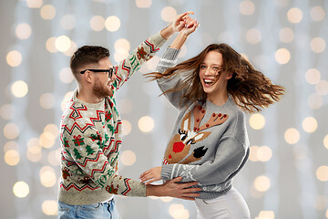 Image showing couple dancing at christmas ugly sweaters party