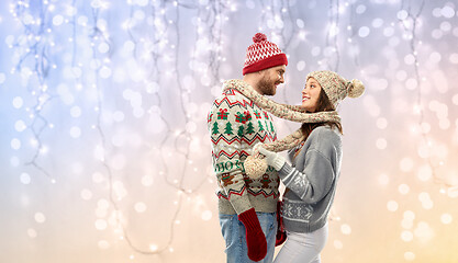 Image showing happy couple at christmas ugly sweater party