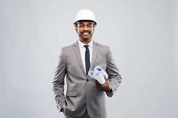 Image showing indian male architect in helmet with blueprints