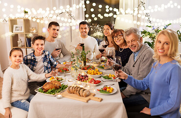 Image showing happy family having dinner party at home