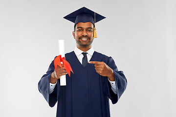 Image showing male graduate student in mortar board with diploma