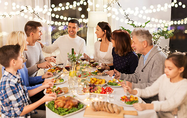 Image showing happy family having dinner party at home