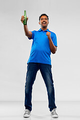 Image showing male fan with beer bottle celebrating victory