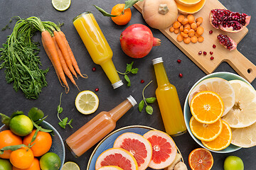 Image showing glass bottles of fruit and vegetable juices