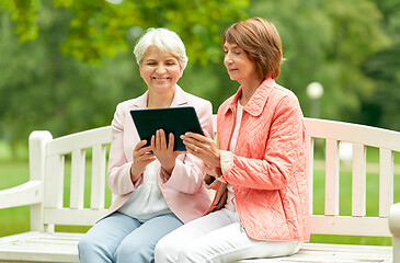 Image showing senior women with tablet pc at summer park