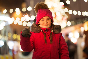 Image showing happy girl with sparkler at christmas market