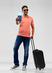 Image showing indian man with travel bag passport and air ticket