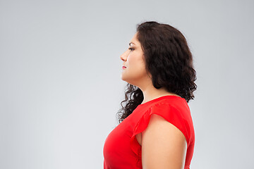 Image showing woman in red dress over grey background