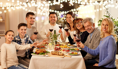 Image showing happy family having dinner party at home