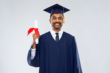 Image showing male graduate student in mortar board with diploma