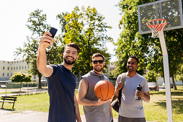 Image showing happy men taking selfie at basketball playground