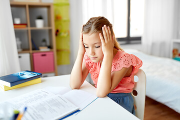 Image showing sad student girl with notebook at home