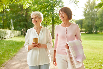 Image showing senior women or friends drinking coffee at park