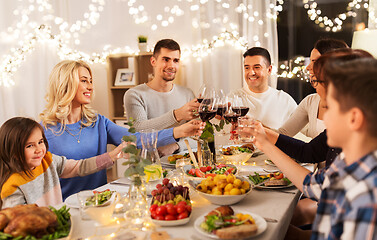 Image showing happy family having dinner party at home