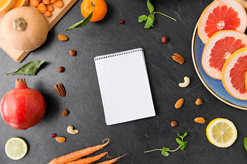 Image showing close up of notebook, fruits and vegetables