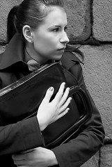 Image showing woman in black holding portfolio
