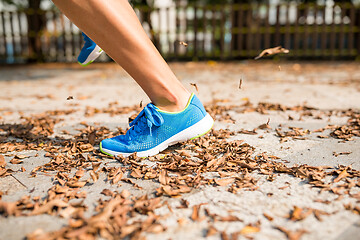 Image showing Woman run in a park