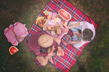 Image showing top view of couple enjoying picnic time