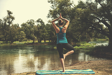 Image showing woman meditating and doing yoga exercise