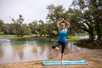 Image showing woman meditating and doing yoga exercise