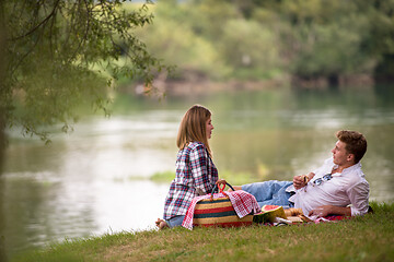 Image showing Couple in love enjoying picnic time