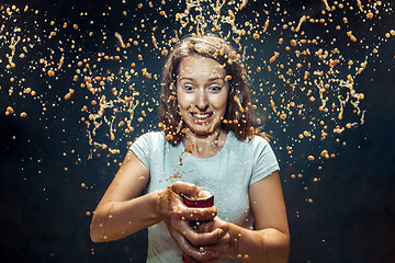 Image showing Woman drinking a cola