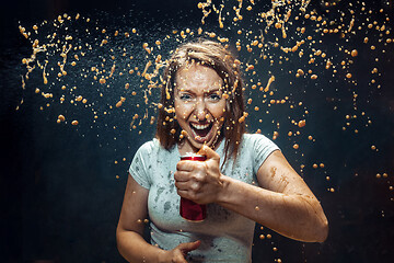 Image showing Woman drinking a cola