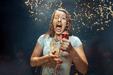 Image showing Woman drinking a cola