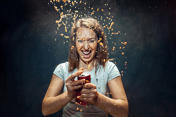 Image showing Woman drinking a cola