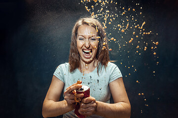 Image showing Woman drinking a cola