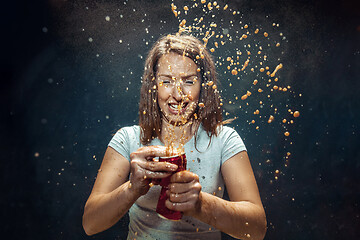 Image showing Woman drinking a cola