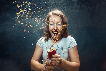 Image showing Woman drinking a cola