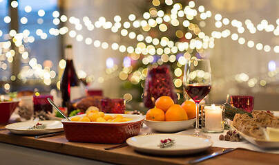 Image showing food and drinks on christmas table at home