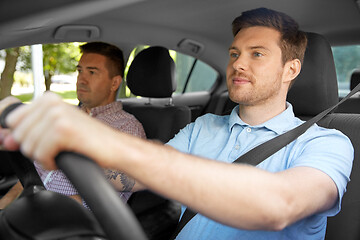 Image showing car driving school instructor and male driver