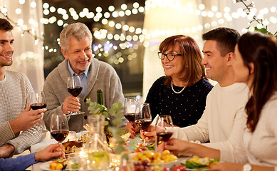 Image showing happy family having dinner party at home