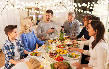 Image showing happy family having dinner party at home