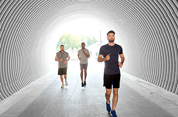 Image showing young men or male friends running outdoors