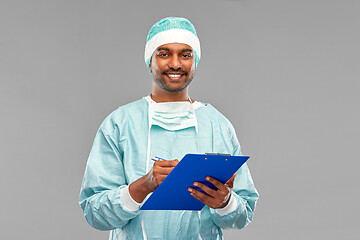 Image showing indian male doctor or surgeon with clipboard