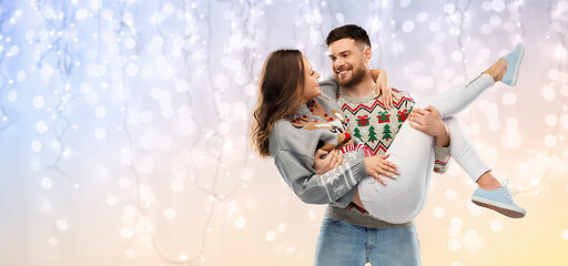 Image showing happy couple at christmas ugly sweater party