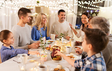 Image showing happy family having tea party at home