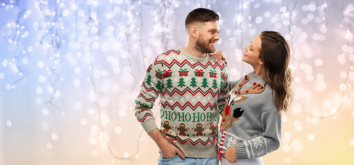 Image showing happy couple at christmas ugly sweater party