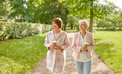 Image showing senior women or friends drinking coffee at park