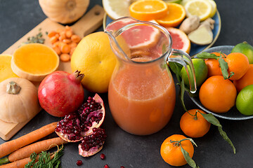 Image showing glass jug of juice with fruits and vegetables