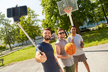 Image showing happy men taking selfie on basketball playground