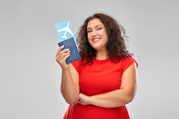 Image showing happy woman with passport and air ticket